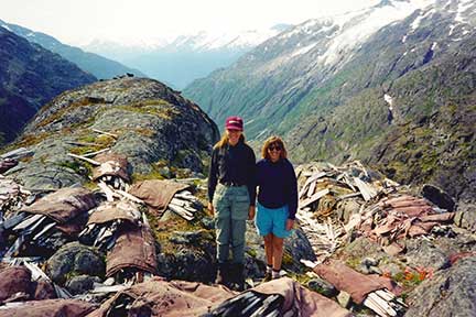 Sherrie and I among abandoned canvas boats at the top of the pass.