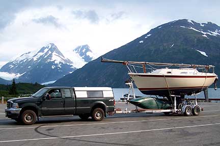 Ford 250 towing trailer with sailboat