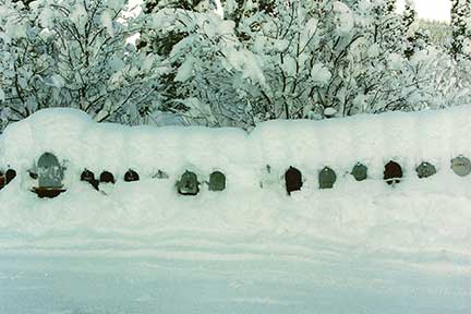 Mailboxes buried in snow
